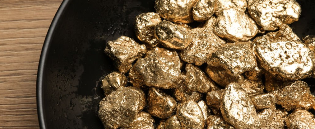 Gold nuggets on a pan